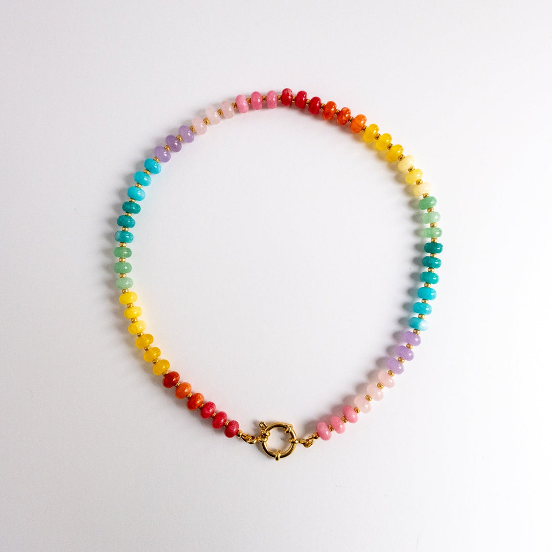 Multicolored beaded necklace on a white background