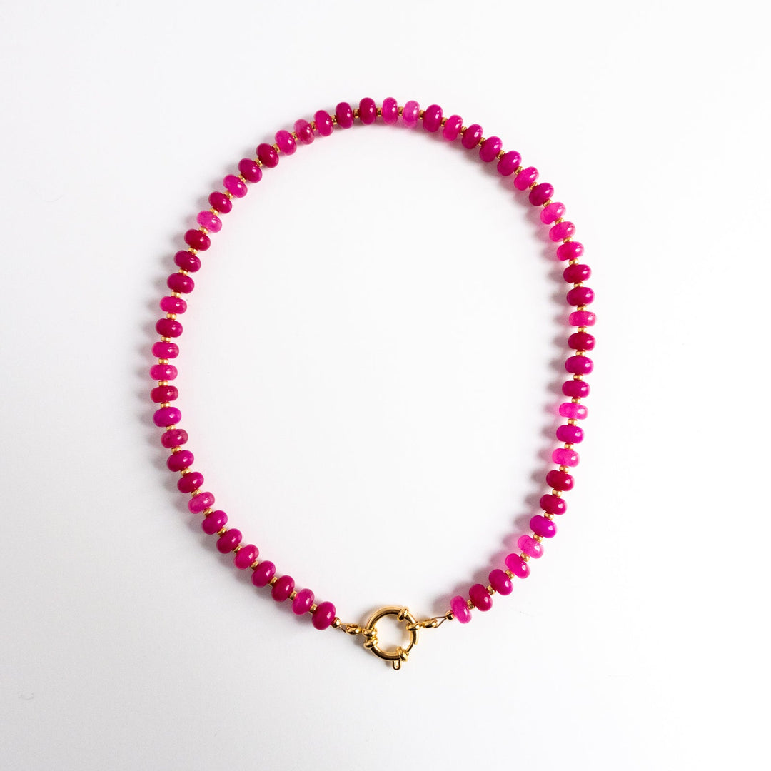 Necklace with pink beads on a white background