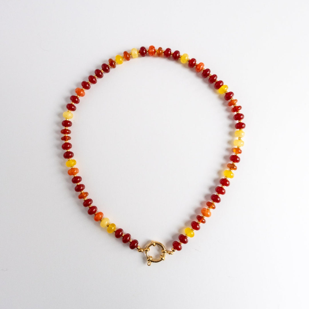Necklace with multicolored beads on a white background