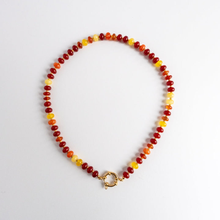 Necklace with multicolored beads on a white background