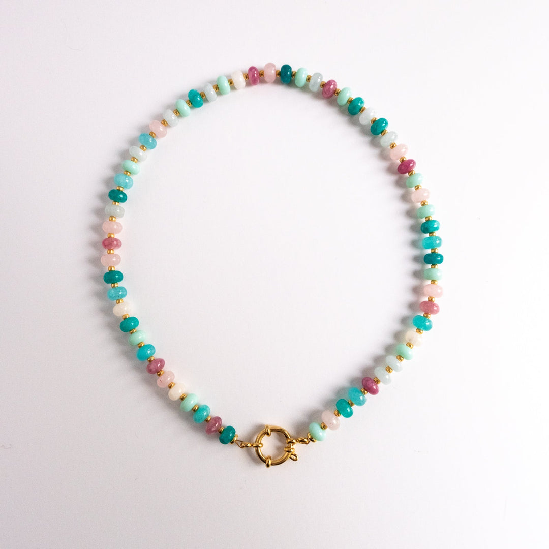 Multicolored beaded necklace with a gold clasp on a white background