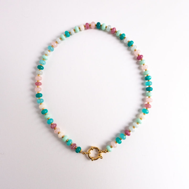 Multicolored beaded necklace with a gold clasp on a white background