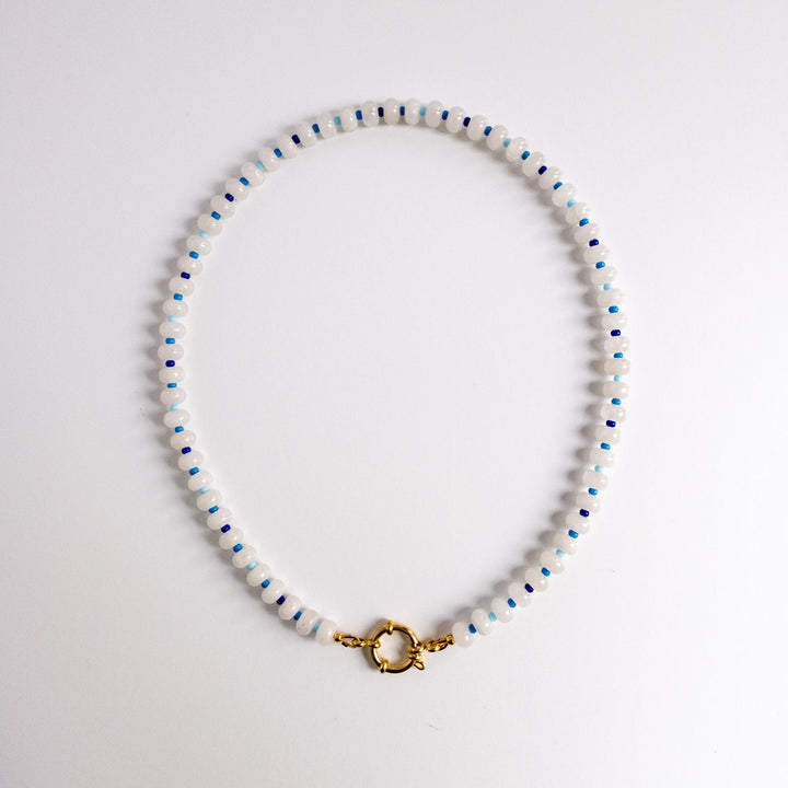 Beaded necklace with a gold clasp on a white background