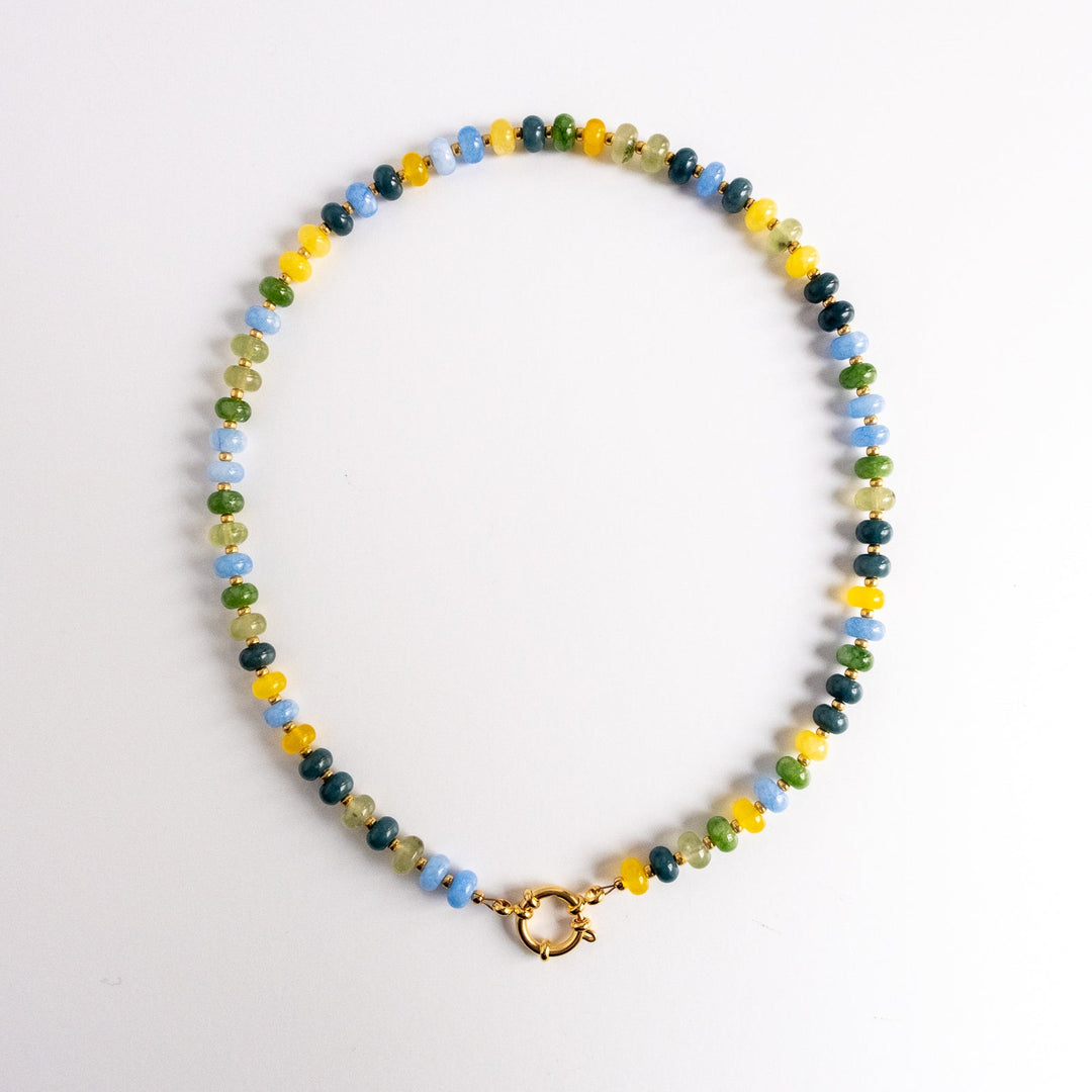 Multicolored beaded necklace with a gold clasp on a white background