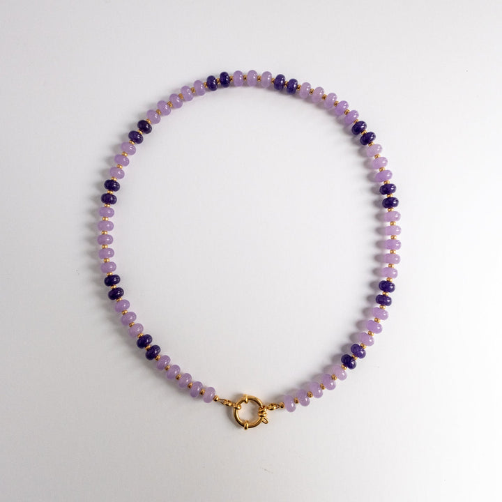 Beaded necklace with a gold clasp on a white background