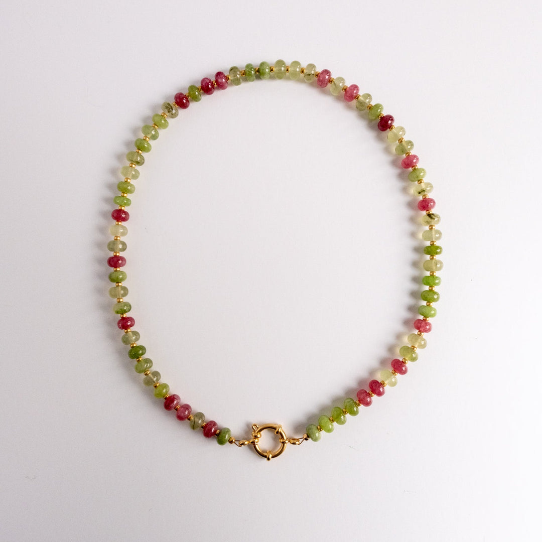 Necklace with multicolored beads on a white background